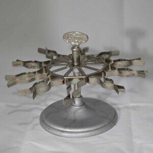 Vintage Metal Achilles Stamp Carousel